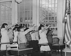 The Bellamy Salute, designed by Francis Bellamy, the author of the Pledge of Allegiance, to be used by American students. It was commonly in practice until 1942 -- for obvious reasons.